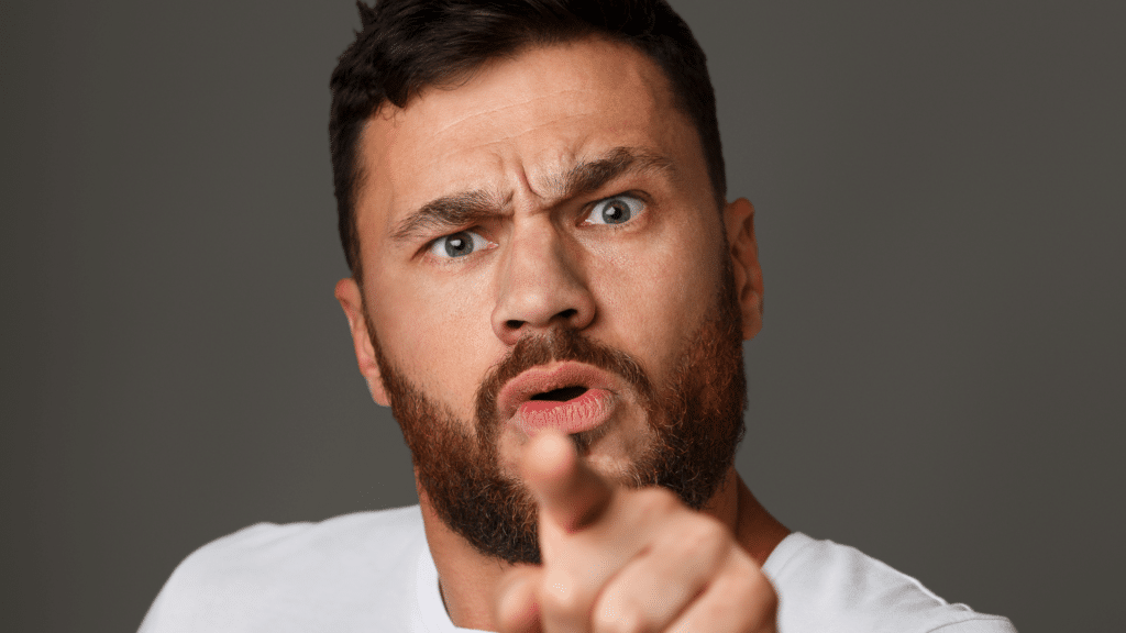 Man pointing at you angry and bitter